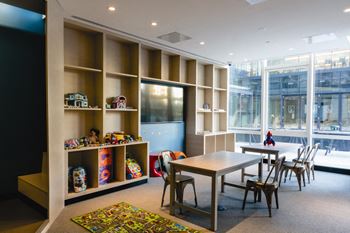 children's playroom toys and books at Tower 28, Long Island City